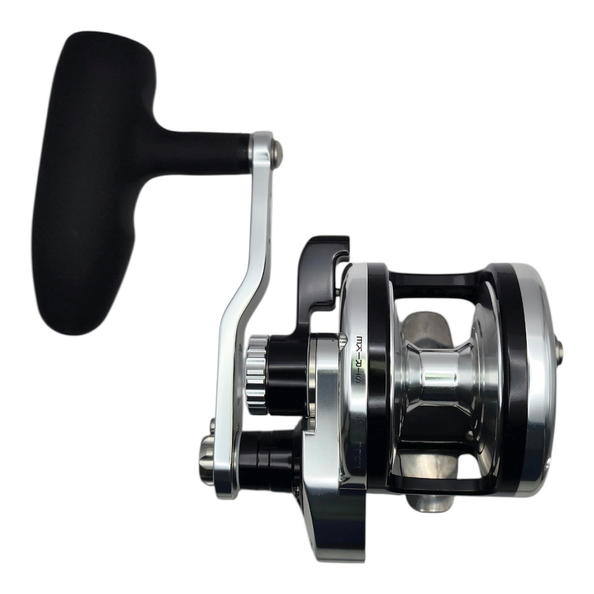  Top view of the Johnny Jigs Elite 15H lever drag jigging reel showing the silver side plate and black T-bar handle